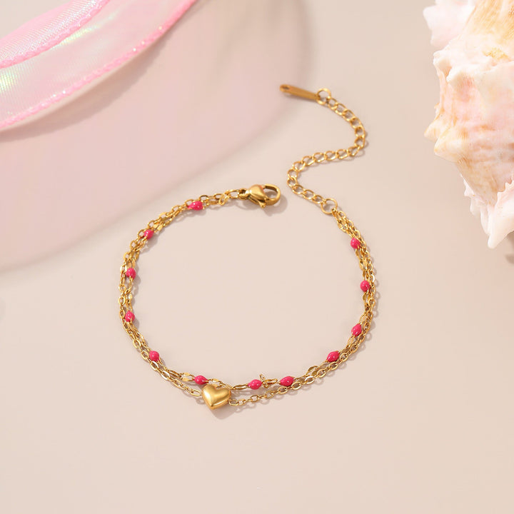 Bracelet Gipsy, perles roses et cœur doré sur double chaîne