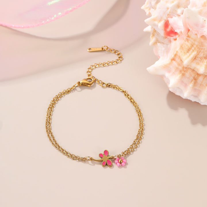Bracelet June, fleur rose émaillée sur chaîne fine dorée